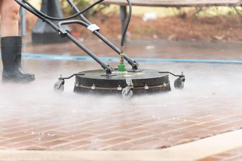 Surface cleaner attachment being used with a pressure washer
