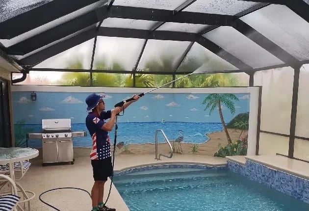 Man-pressure-washing-pool